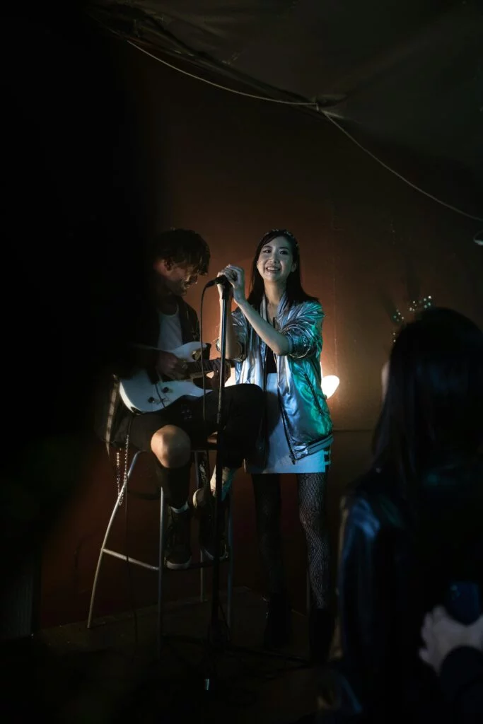 Singer performing live music on stage