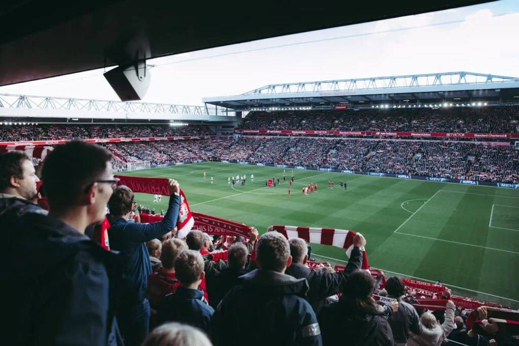 Football supporters watching a match in a bar